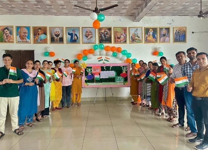 Students celebrating Independence Day with the national flag